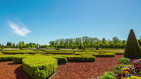 Motion-timelapse-of-people-walking-in-botanical-gardens-of-the-Rundale-palace-in-Latvia