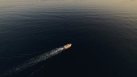 Droneshot-of-Delta-speedboat-riding-in-the-sunset
