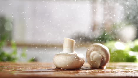Slow-motion-of-white-and-brown-mushrooms-falling-on-wet-wooden-board-in-a-kitchen