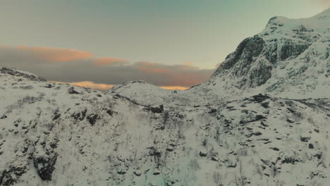 Drone-shot-of-Mountains-in-winter-during-sunset