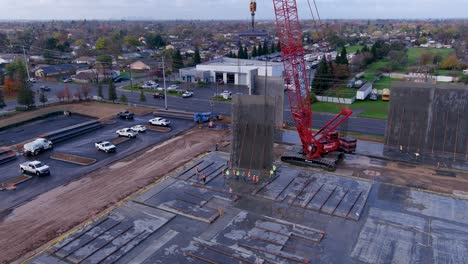 Concrete-wall-being-placed-in-a-industrial-building-with-a-crane