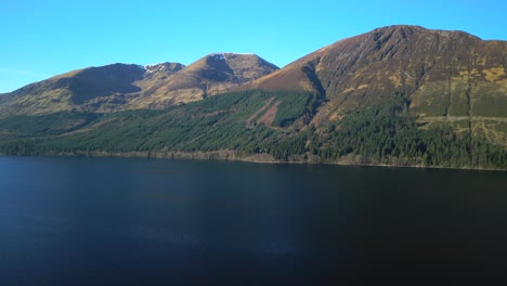High-altitude-rise-over-dark-with-mountains-lake-Loch-Lochy-Scottish-Highlands