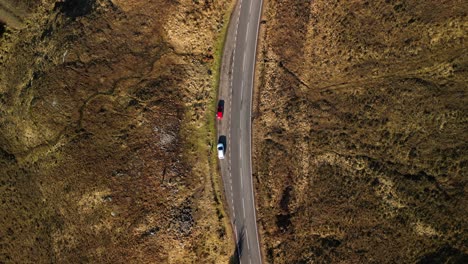 Spin-rise-of-mountain-road-with-traffic-next-to-Loch-Loyne-in-Scottish-Highlands