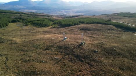 Radio-masts-near-Loch-Loyne-Scottish-Highlands-with-slow-spin-showing-local-rugged-landscape