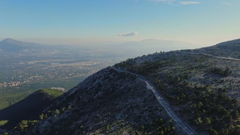 Mountain-road-with-city-of-Athens-in-the-background---Parnitha