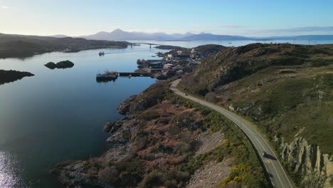 Rise-up-revealing-Kyle-of-Lochalsh-with-traffic-and-Skye-bridge-in-Scottish-Highlands