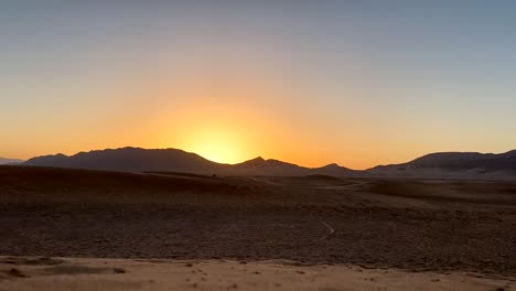 Beautiful-sunrise-in-Sahara-Desert-with-sand-dunes-and-mountains