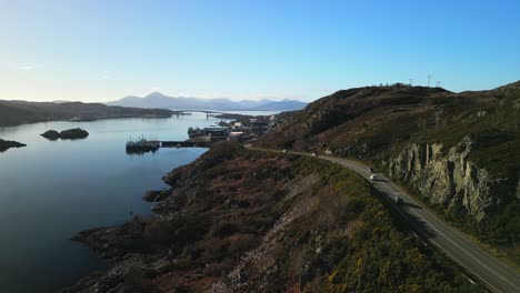 Rise-up-showing-busy-road-to-Kyle-of-Lochalsh-with-Skye-bridge-and-Cuillin-mountains-in-Scottish-Highlands