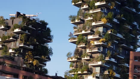 Tall-green-eco-apartments-with-plants-on-outside-building-close-up