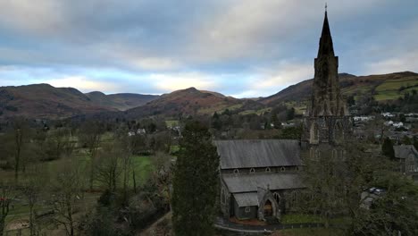 Aerial-footage-of-Ambleside-the-Lakeland-town-and-former-civil-parish,-now-in-the-parish-of-Lakes,-in-Cumbria,-in-North-West-England-2023