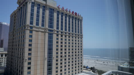 Caesar's-Casino-and-Hotel---Building-During-the-Day-with-Beach-in-Background---Atlantic-City,-NJ