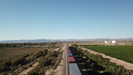 Cargo-train-stopped-in-desert-town