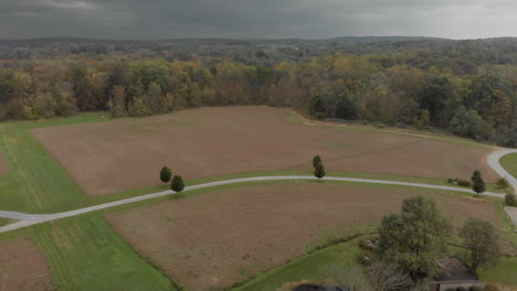 Cloudy-Day-over-Field-Drone-Shot---Brandywine-Manor-House,-PA