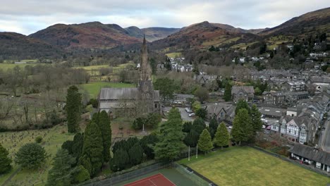 Aerial-footage-of-Ambleside-the-Lakeland-town-and-former-civil-parish,-now-in-the-parish-of-Lakes,-in-Cumbria,-in-North-West-England-2023