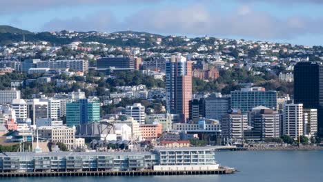 Inner-city-urban-landscape-view-of-Wellington-in-New-Zealand-Aotearoa,-harbour,-waterfront,-apartments,-church,-university-and-office-blocks-in-the-capital-city