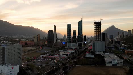 Drone-shot-rising-around-buildings-in-the-San-Pedro-Garza-Garcia,-Monterrey,-sundown-in-Mexico