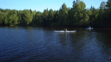 two-people-out-kayaking-on-the-lake-in-the-sun