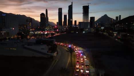 Aerial-view-over-police-cars-at-a-traffic-jam-in-Monterrey-city,-dusk-in-Mexico
