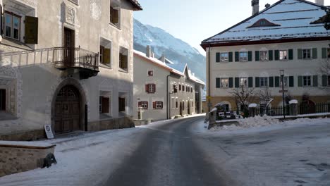 View-of-a-street-and-houses-in-a-traditional-Swiss-village-of-Zuoz,-Switzerland