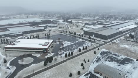 Winter-Drone-flight-over-a-corporate-campus-in-Olean,-New-York