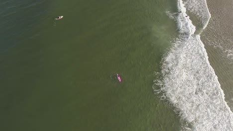Top-down-drone-view-of-surfers-at-Nauset-Beach-in-Cape-Cod-Massachusetts