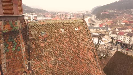 A-drone-shot,-with-forward-motion,-capturing-a-glimpse-of-the-city-of-Sighisoara-on-an-afternoon