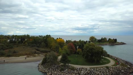 Aerial-view-of-the-Scarborough-Bluffs,-Canada,-located-in-Lake-Ontario,-with-a-smooth-forward-camera-pan