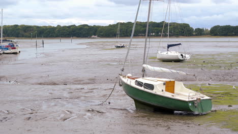 A-moored-boat-in-Chichester-harbour-at-low-tide