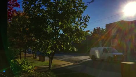 Early-morning-time-lapse-of-crosswalk-and-street-traffic-in-Toronto's-east-end-with-lens-flare