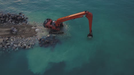 Hitachi-EX1200-Super-Long-Reach-Excavator-puts-stones-into-the-sea-to-build-a-stone-breakwater
