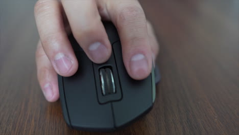 Close-up-of-hand-using-bluetooth-mouse
