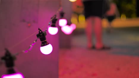 4k-illuminated-hanging-light-bulb-during-christmas-season-at-southbank,-brisbane