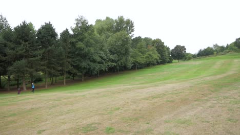 Wide-shot-of-the-course-as-a-player-hits-a-shot-to-the-green
