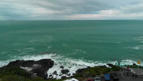 Stewart-Island-in-the-background-and-ocean-sea-coast-from-Stirling-Point,-Bluff-,-New-Zealand---Aerial-Drone