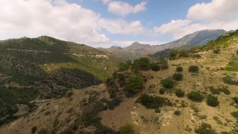 Drone-footage-of-mountain-ranges,-forest-and-horizon
