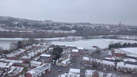 Push-forward-drone-shot-of-a-snowy-Exeter-looking-towards-the-River-Exe