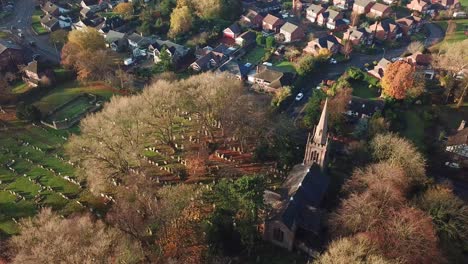 Aerial-rotating-shot-above-UK-church-in-rural-town