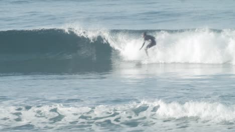 Surfer-shredding-small-wave-catching-some-air