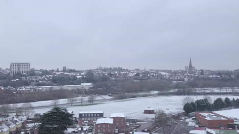 Tracking-drone-shot-of-snowy-Exeter-subburbs-looking-towards-the-town-centre-CROP