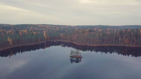 small-island-in-calm-lake-aerial-footage