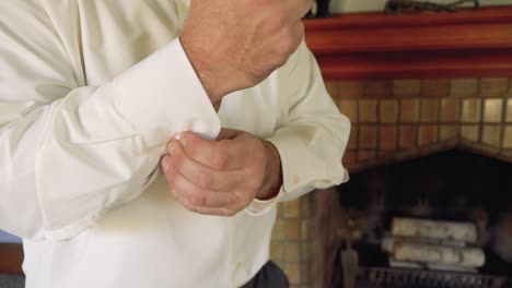 Caucasian-Man-Slowly-Buttons-White-Dress-Shirt-Sleeve-Cuff