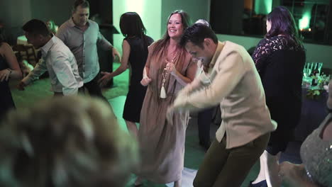 Crowd-of-happy-people-having-fun-on-the-dance-floor-at-a-wedding