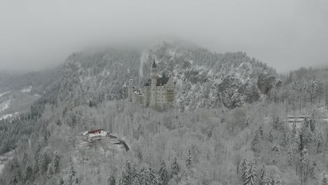 Aerial-View-Of-Neuschwanstein-getting-altitude-while-flying-towards-to-the-castle