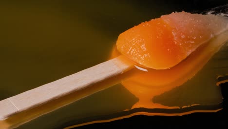 Close-up-shot-of-a-rocket-popsicle-with-a-chopstick-melting-time-lapse