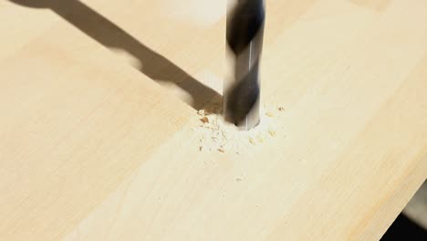 Close-up-of-a-bit-drilling-a-hole