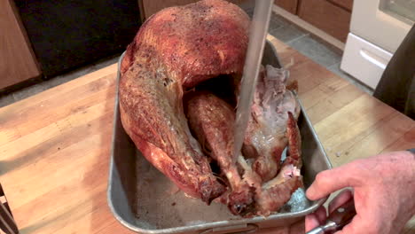 Home-cook-carving-a-big-delicious-turkey