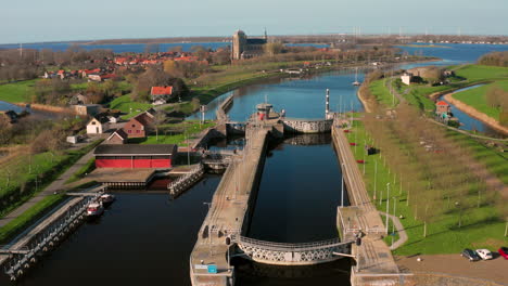 Aerial:-The-locks-of-the-Canal-through-Walcheren,-near-the-historical-town-Veere