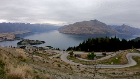 Luge-track-going-down-the-side-of-the-mountain-in-Queenstown-New-Zealand-overlooking-Lake-Wakapuki