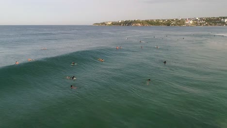 Slow-Motion:-Aerial-shot-of-a-surfer-surfing-a-big-tube-barrel-wave-and-falling-in-Zicatela-beach-Puerto-Escondido,-Oaxaca