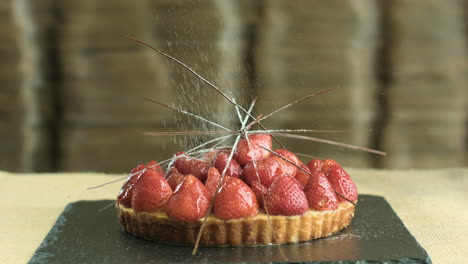Strawberry-Cake-Topped-With-Powdered-Sugar-And-Nuts